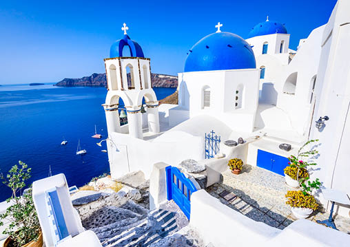 Oia, Santorini - Greece  Famous attraction of white village with cobbled streets, Greek Cyclades Islands, Aegean Sea 