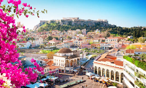 Skyline of Athenth with Moanstiraki square and Acropolis hill with flowers, Athens Greece