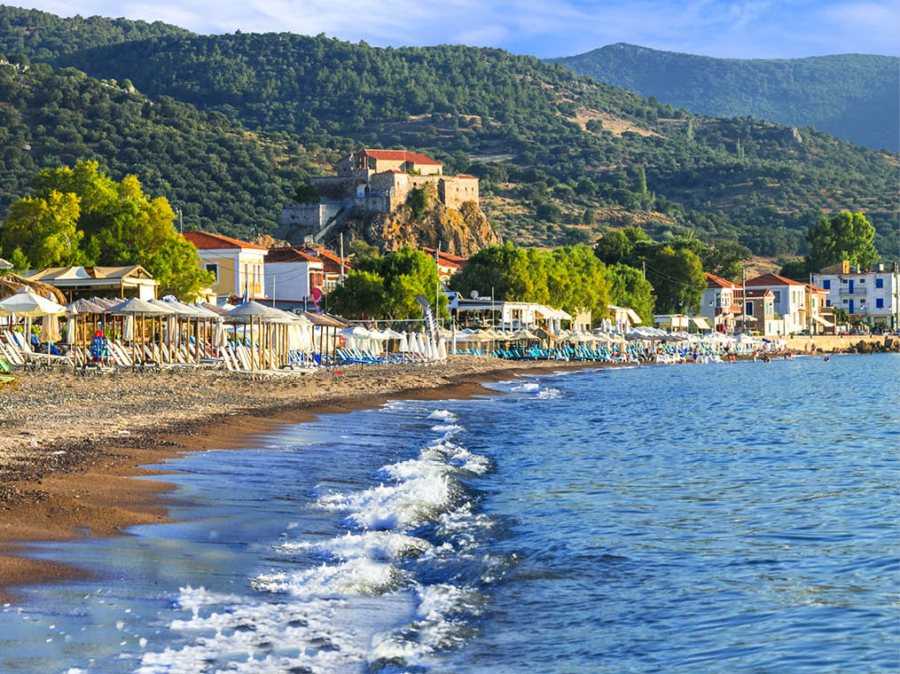 Lesvos island   Greece  Beautiful coastal village Petra with famous monastery over the rock and great beach