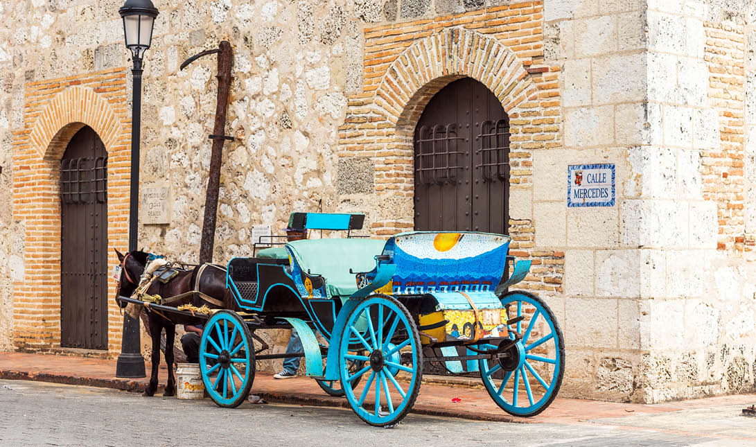 Retro carriage with a horse on a city street in Santo Domingo, Dominican Republic  Copy space for text