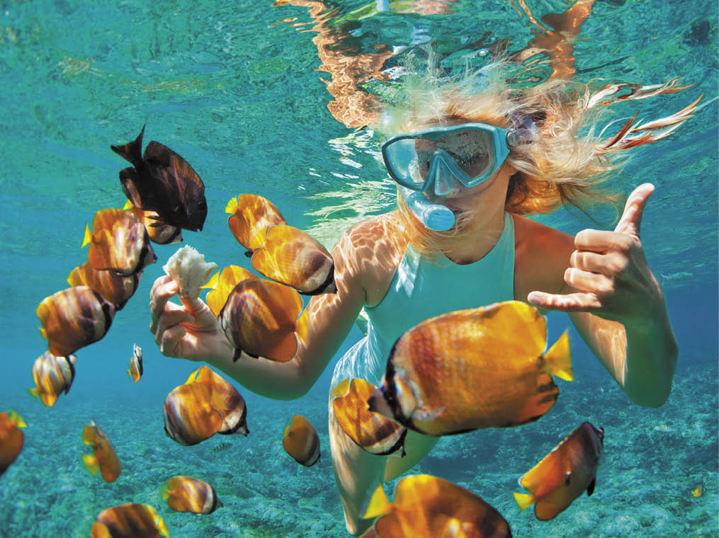 Happy family - girl in snorkeling mask dive underwater with tropical fishes in coral reef sea pool  Travel lifestyle, water sport outdoor adventure, swimming lessons on summer beach holiday with kids