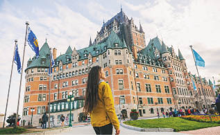 Quebec city travel woman walking on Promenade Terrasse Duffering visiting old town  Autumn Canada vacation destination for cruise ships 