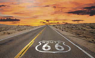 Route 66 pavement sign sunrise in California's Mojave desert 