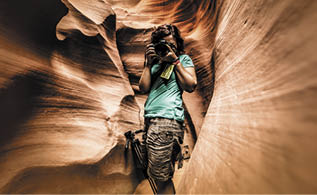 A photographer in the Lower Antelope Canyon (Arizona)