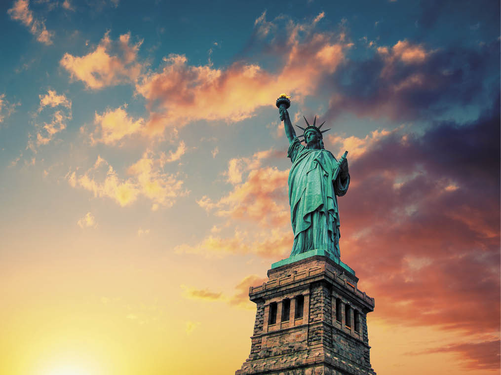 New York City, The Statue of Liberty at sunset with a beautiful vanilla sky 
